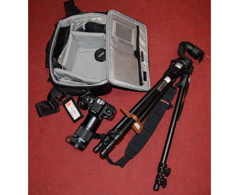 A Nikon *F4* digital camera in soft carry case with further accessories to include tripod etcCamera is actually an F4 model.N