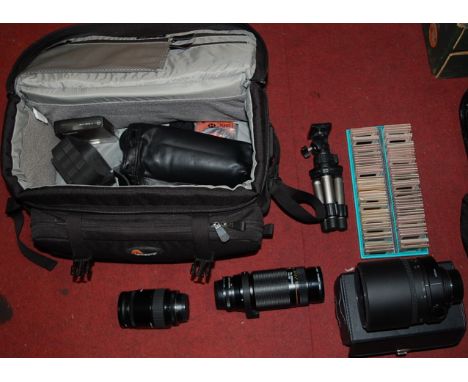 A quantity of various camera parts and accessories to include Portaflash, Sigma lens and a leather travel case etc