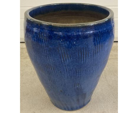 A large blue glazed ceramic garden planter, approx. 52cm tall x 41cm diameter. 