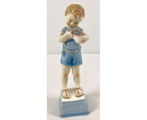 A late 1930's Royal Worcester porcelain figurine of a small boy with his kitten. Model No. 3261 entitled "My Pet" to undersid