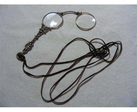 A fine early C20th cased spring-folding Lorgnette, or handled pair of Reading Spectacles, set with paste decoration and in fi