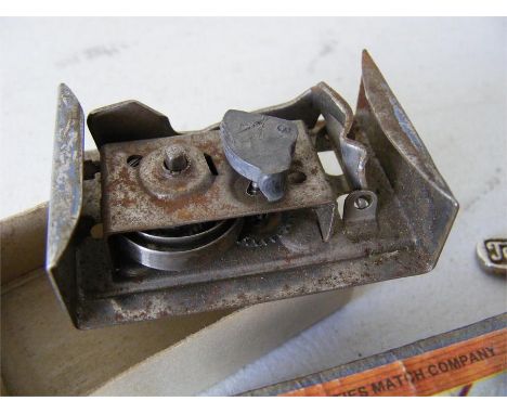 A vintage clockwork matchbox motor (c/w key) contained within a Norwich-interest matchbox.