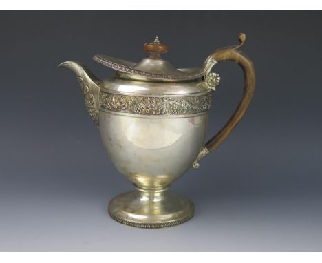 A George III silver coffee pot, maker Rebecca Emes &amp; Edward Barnard I, London, 1812, of ovoid form with grape and vine le
