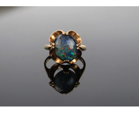 A 9ct Gold and Opal doublet ring, stone 13.5 x 11mm, ring size approximately K.