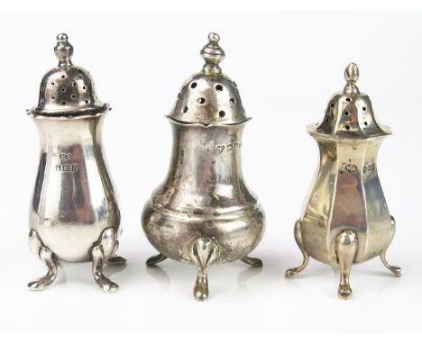 Three silver pepperettes, various makers and dates, 7cm and 8cm high, total weight of silver 112gms, 3,62ozs. 