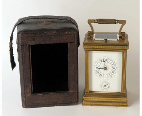 A late 19th century French brass carriage clock, with 8cm Roman dial with subsidiary alarm dial, the movement with lever plat