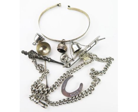 A Group of Silver, to include a curb chain, bangle, salt spoon, horse shoe, cow bell, buttonhook, bull charm and bar brooch w