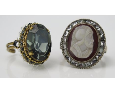 A Carved Cameo Dress Ring, of a classical knight surrounded by foil wrapped white stones, together with another dress ring 