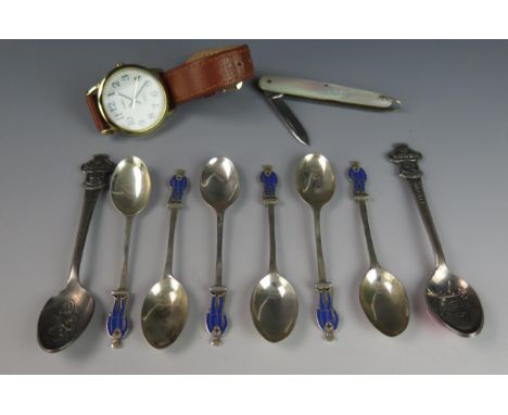 Liberty &amp; Co, a set of six silver and enamel injured veterans fund coffee spoons, the enamelled terminals in the form of 