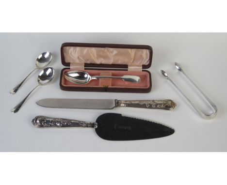 A mixed collection of silver flatware, various makers and dates, includes silver handled cake knife, cake slice, sugar tongs,