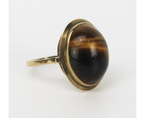 A Tigers Eye and 9ct Gold Ring, the cabochon 17x13mm, ring size R/S, 4.6g