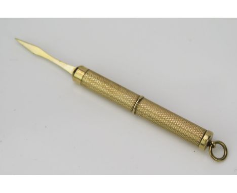 A 9ct Gold Tooth Pick, with engine turned decoration, 5.5cm long 6.7g. 