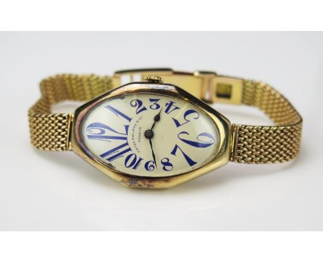 An Exceptional and Rare Patek Philippe 14ct gold wristwatch with oval dial having blue Arabic numerals, Serial No 181394 and 