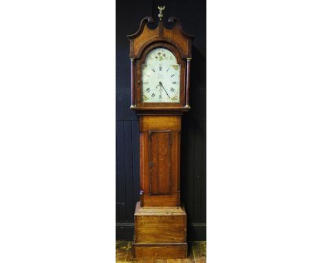 John Bell, Hexham, an oak longcase clock, the 4 arched hood with broken swan neck pediment and eagle and ball finial, the tru