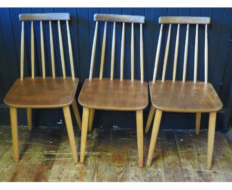 A set of three Danish stick back chairs by Billund Trasvarafabrik, with solid seats on slender legs, bears makers stamp and D