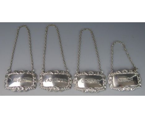 A set of four continental silver spirit labels, 'Rhum', 'Kirsch', 'Eau de Vie' and 'Cognac', each 6cm wide, 49gms, 1.59ozs 