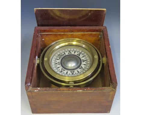 A silvered compass with 9.5 dial mounted in a brass gimbal and wood box, 19.5cm wide 