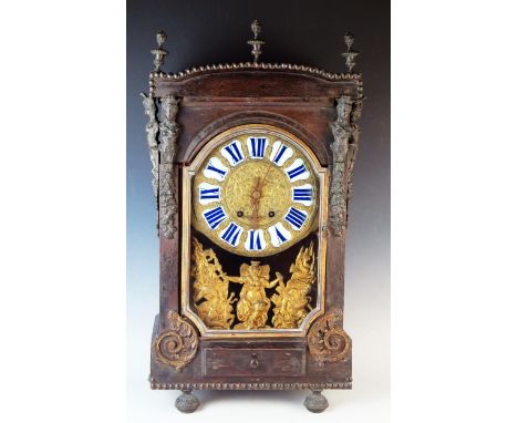 A 19th century French mantel clock, of rectangular outline, decorated with caryatids and flaming urn finials,  having a singl