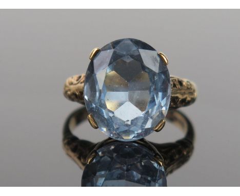 An Oval SolitairePale Blue Stone and 9ct Gold Cocktail Ring, 14x12mm, ring size N.25, 5.2g