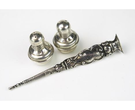 A pair of continental silver condiments, 5cm high , together with a continental silver pin holder with belt strap, 15cm long 