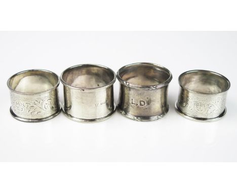 Four assorted silver napkin rings, various makers and dates, three bearing initials, total weight of silver 66gms, 2.13ozs. 