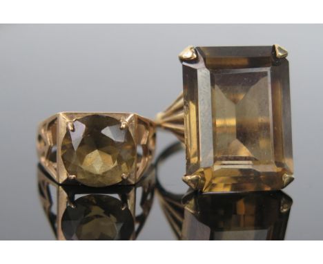 A Smokey Quartz and 9ct Gold Cocktail Ring, the rectangular cushion cut 20x15mm, hallmarked 9ct, ring size N.5, together with