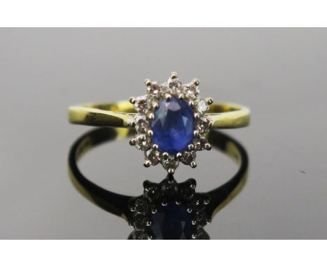 Sapphire and Diamond Cluster Ring in an 18ct hallmarked setting, 11x9mm head, size P.5, 3.1g 