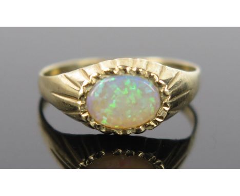 A 9ct Gold and Opal Ring, size M.25, 1.7g