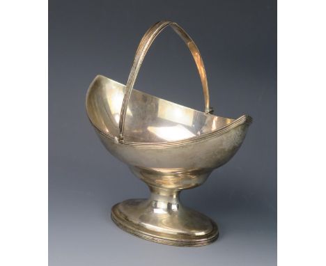 A George III silver swing-handled sugar basket, maker Peter,, Ann &amp; William Bateman, London, 1800, monogrammed, of navett