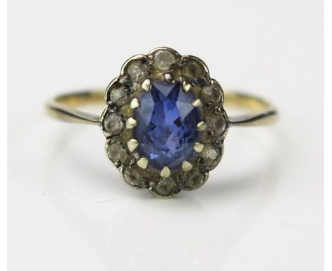 A Blue and White Stone Cluster Ring, unclear stamped marks 9 or 18ct, 11x10mm head, size O, 1.9g