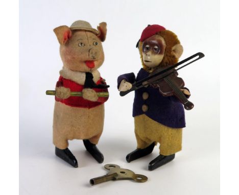 Schuco Clockwork Pig playing a penny whistle and monkey playing a fiddle, c. 12cm high 