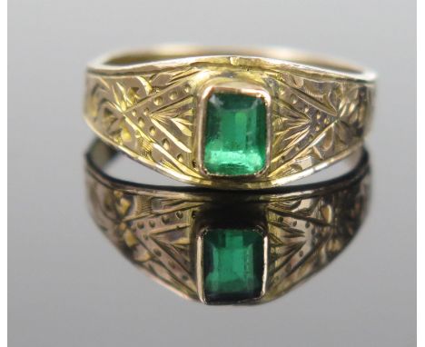 A 19th Century Unmarked Yellow Metal and Green Paste Ring with chased decoration, size J, 1.3g