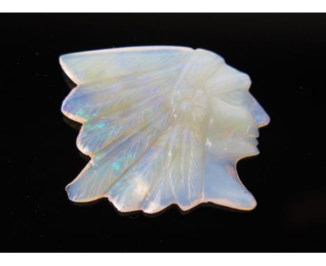 A Carved Opal of a Native American Chief, in head dress, 20x25mm. 