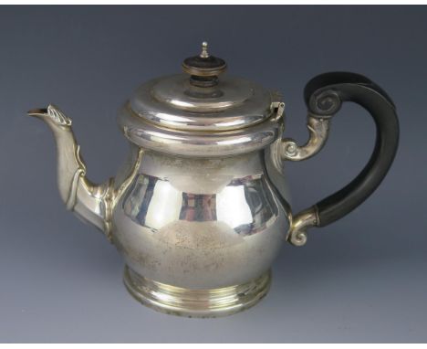 A George V silver teapot, maker Wakely &amp; Wheeler, London, 1911, of squat ovoid form with acanthus capped spout, raised on