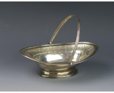 A George III silver swing handled sweetmeat dish, maker Henry Chawner, London, 1791, monogrammed, of oval outline with chased