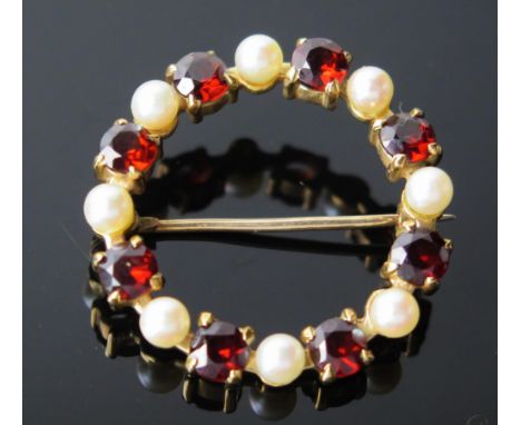 An untested Pearl, Garnet and 9ct Gold Brooch, of circular form, 30mm diameter, hallmarked 9ct, 5.3g total. 