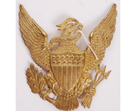 A 19th century post American Civil War style brass helmet plate / plaque depicting the National Coat of Arms of the United St