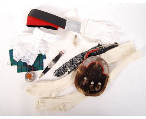 A collection of 20th century Scottish highland pipers accessories to include a reproduction sporran with fur to the front and