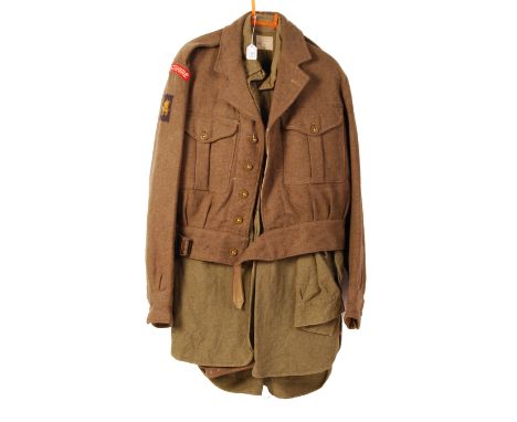 A post-WWII Second World War battledress Wiltshire regiment uniform comprising of Battledress trousers, shirt and battledress