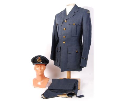 A mid-20th century gentleman's British RAF service uniform with crown embossed buttons, featuring patches reading ' R. A. F. 