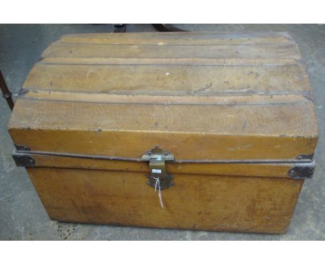 Vintage dome topped, metal two-handled trunk.