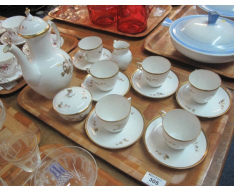 Royal Copenhagen porcelain coffee set on a white ground with gilt banding rose decoration comprising: six cups and saucers; l