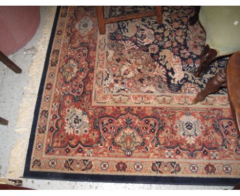 Large Persian design carpet with foliate, floral and mythical creatures adorning it. CONDITION REPORT: Worn in places.Measure