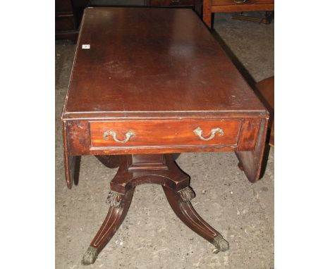 19th Century mahogany sofa table on quatraform legs, brass paws and casters.