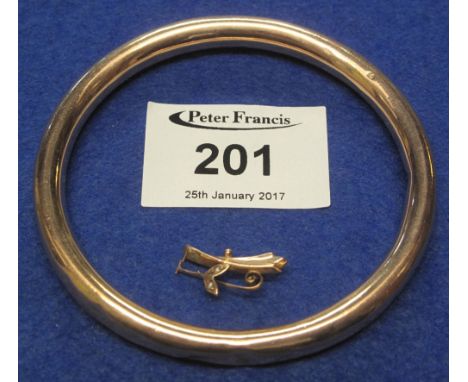 9ct gold hollow slave bangle and a small gold pin brooch. CONDITION REPORT: Weight - 17g approximately