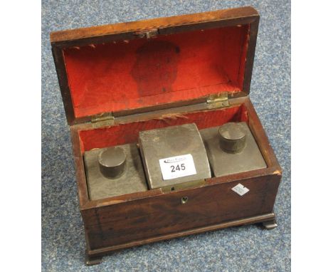 George III mahogany tea caddy, fitted with zinc containers and having strung, inlaid front panel, standing on ogee bracket su
