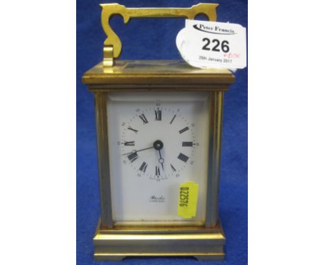 20th Century French brass carriage clock with full depth enamel face, having Roman numerals, marked: Brooks, Llandudno.  Orig