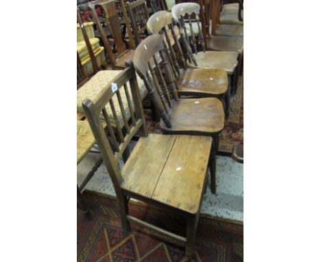 Three similar elm spindle back farmhouse kitchen chairs together with a 19th Century oak stick back farmhouse chair. (4)