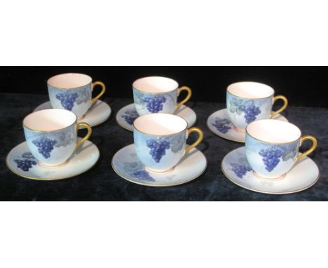 Set of six Royal Worcester bone china coffee cups and saucers, painted with grapes and foliage on a graduated blue ground. (6