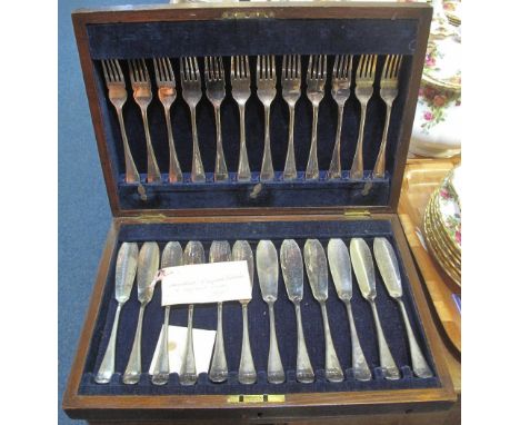 Silver plated fish knife and fork set in fitted oak box.